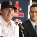 John Lackey of the Boston Red Sox speaks as general manager Theo Epstein (right) smiles during a press conference introducing Lackey as a member of the Red Sox at Fenway Park on Wednesday, December 16, 2009 in Boston, Massachusetts.
