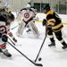 The Webster Groves Skatesmen and the Lutheran South Lancers battle for the puck during the game on Tuesday, Dec. 5. The Skatesmen defeated the Lancers 10-4. The Lutheran South hockey team is back on the ice after a year hiatus.| PHOTO - Ursula Ruhl