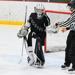 Ref taking puck from goalie
