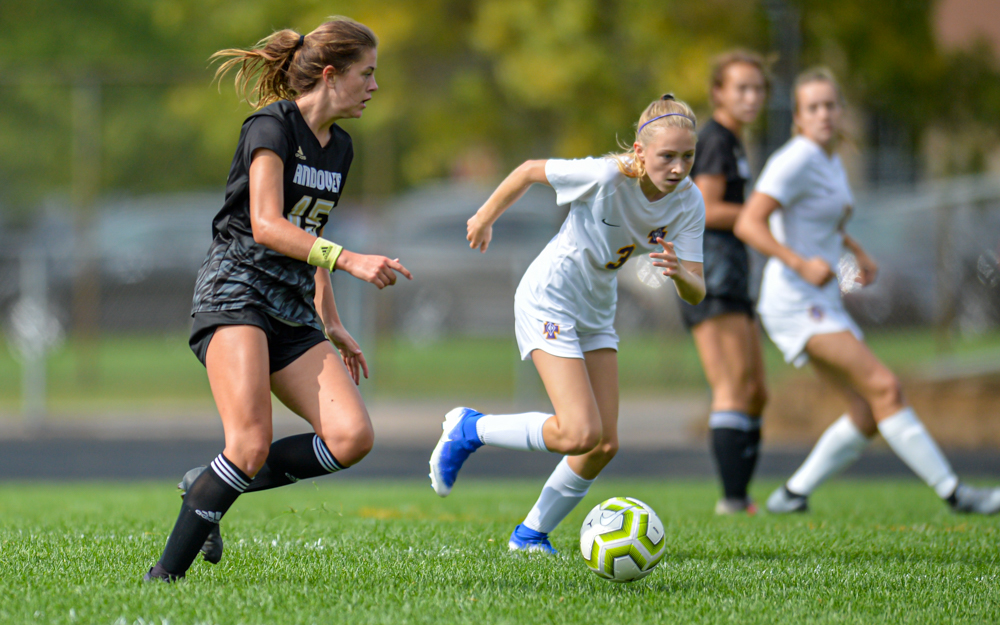 Andover’s Olivia Knoepfle (left) en route to scoring the game-winning goal midway through the second half, giving the Huskies a 2-1 lead. Andover beat Cretin-Derham Hall at home Saturday afternoon 4-1. Photo by Earl J. Ebensteiner, SportsEngine