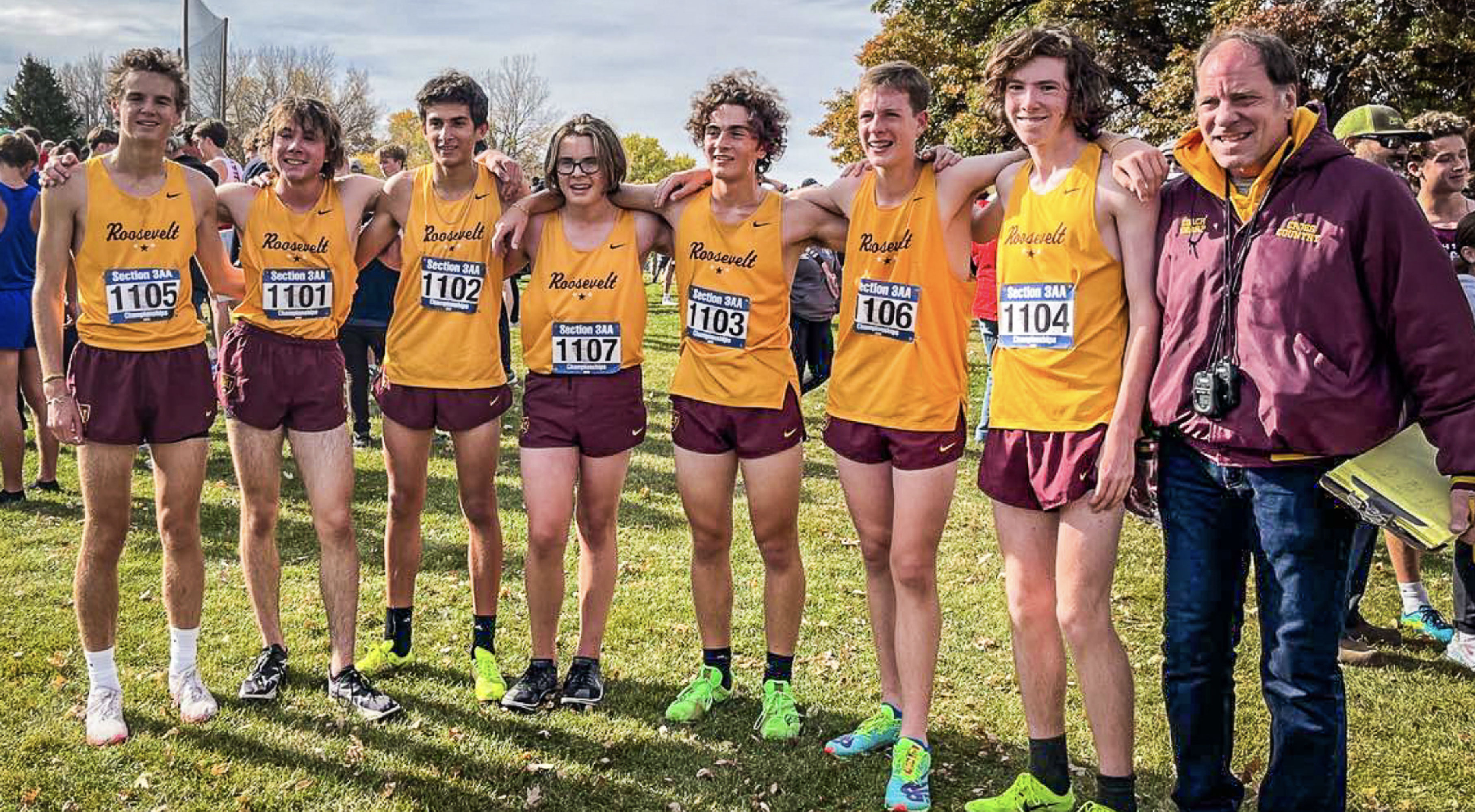 Minneapolis Roosevelt Boys Cross Country team pose with their coach after the Section 3AA meet