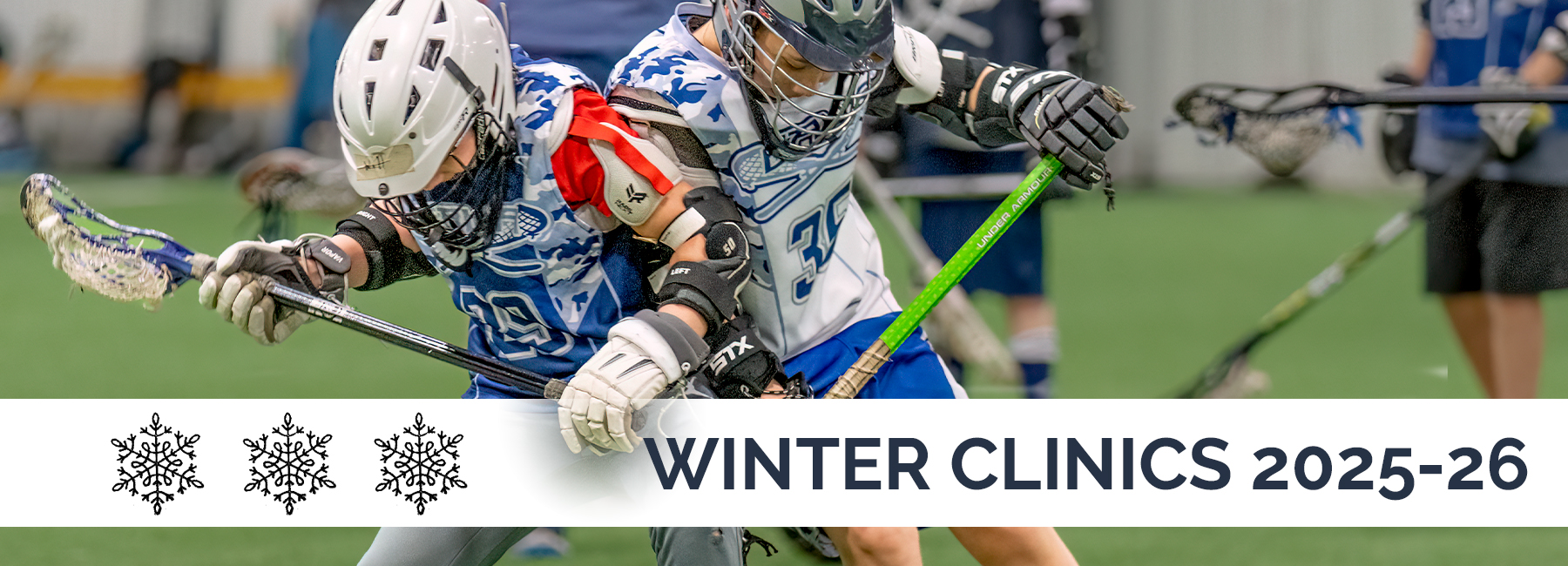 Boys Playing Lacrosse Indoors