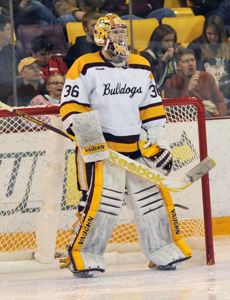 Photos of Minnesota goalies playing men's college hockey Photos
