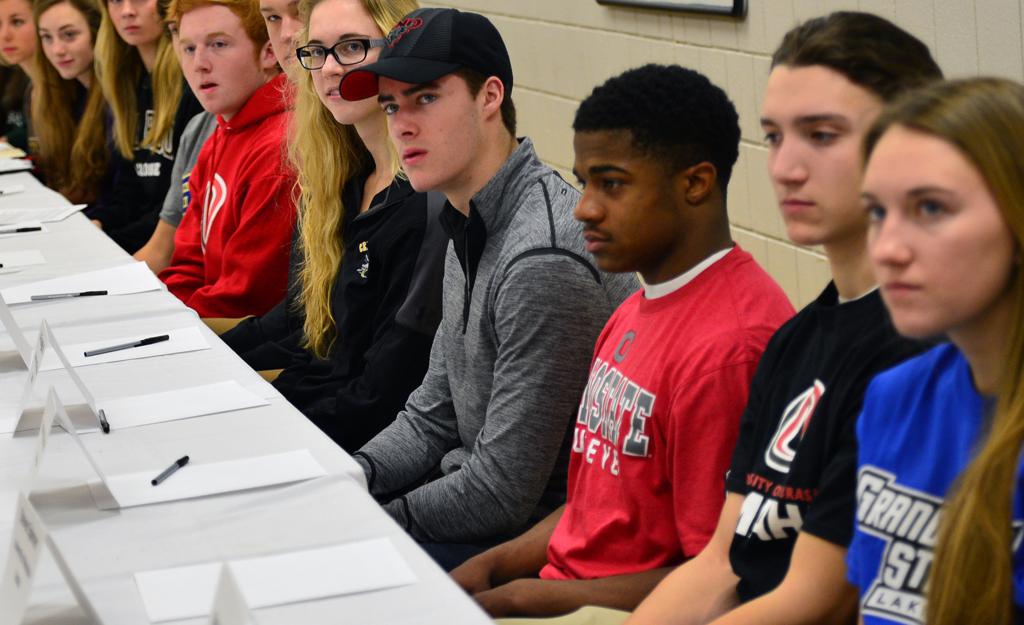 Twenty Eden Prairie athletes in different sports sign together