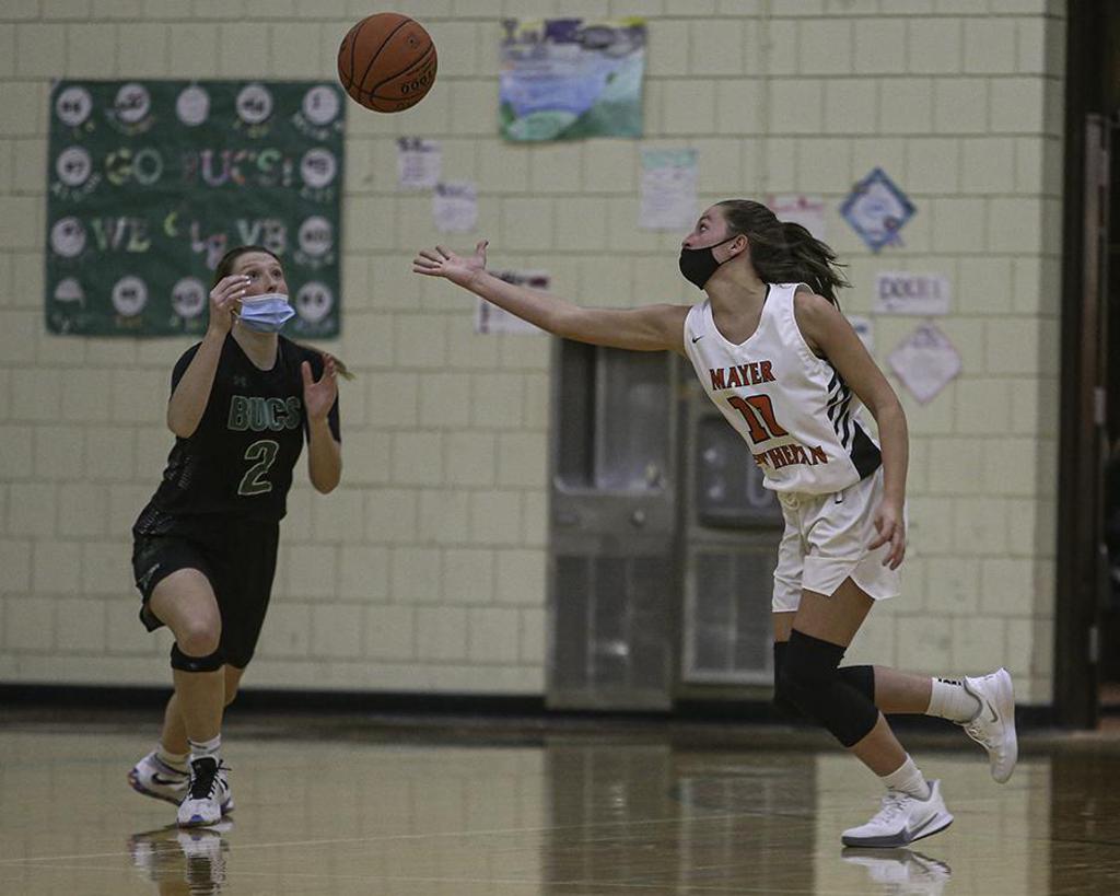 Waterville-Elysian-Morristown senior Brielle Bartelt (2) and Mayer Lutheran sophomore Stella Maass track a loose ball during the Buccaneers' 59-55 victory. Photo by Mark Hvidsten, SportsEngine