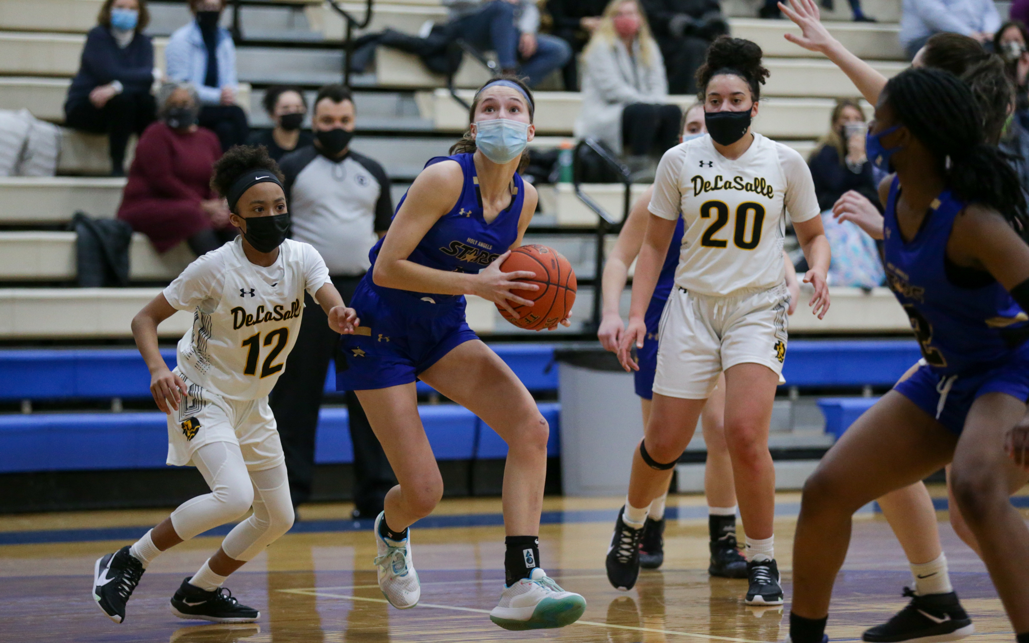 Holy Angels' Francesca Vascellaro (1) drives toward the basket during the first half of Friday night’s game against DeLaSalle. Vascellaro had a game-high 24 points in the Stars’ 96-69 victory over the Islanders. Photo by Jeff Lawler, SportsEngine