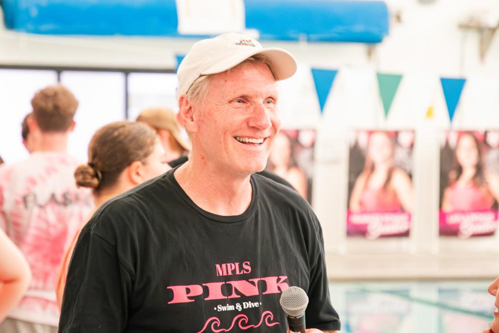 Minneapolis TNT Swim and Dive coach shouts encouragement to his swimmers