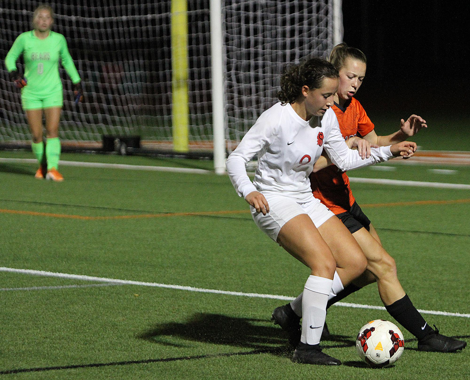 Stillwater's Marissa Bonilla battles for the ball along the sideline late in the second half. Stillwater shut out the host Bears for a 2-0 win that keeps them in first place atop the conference standings. Photo by Drew Herron, SportsEngine