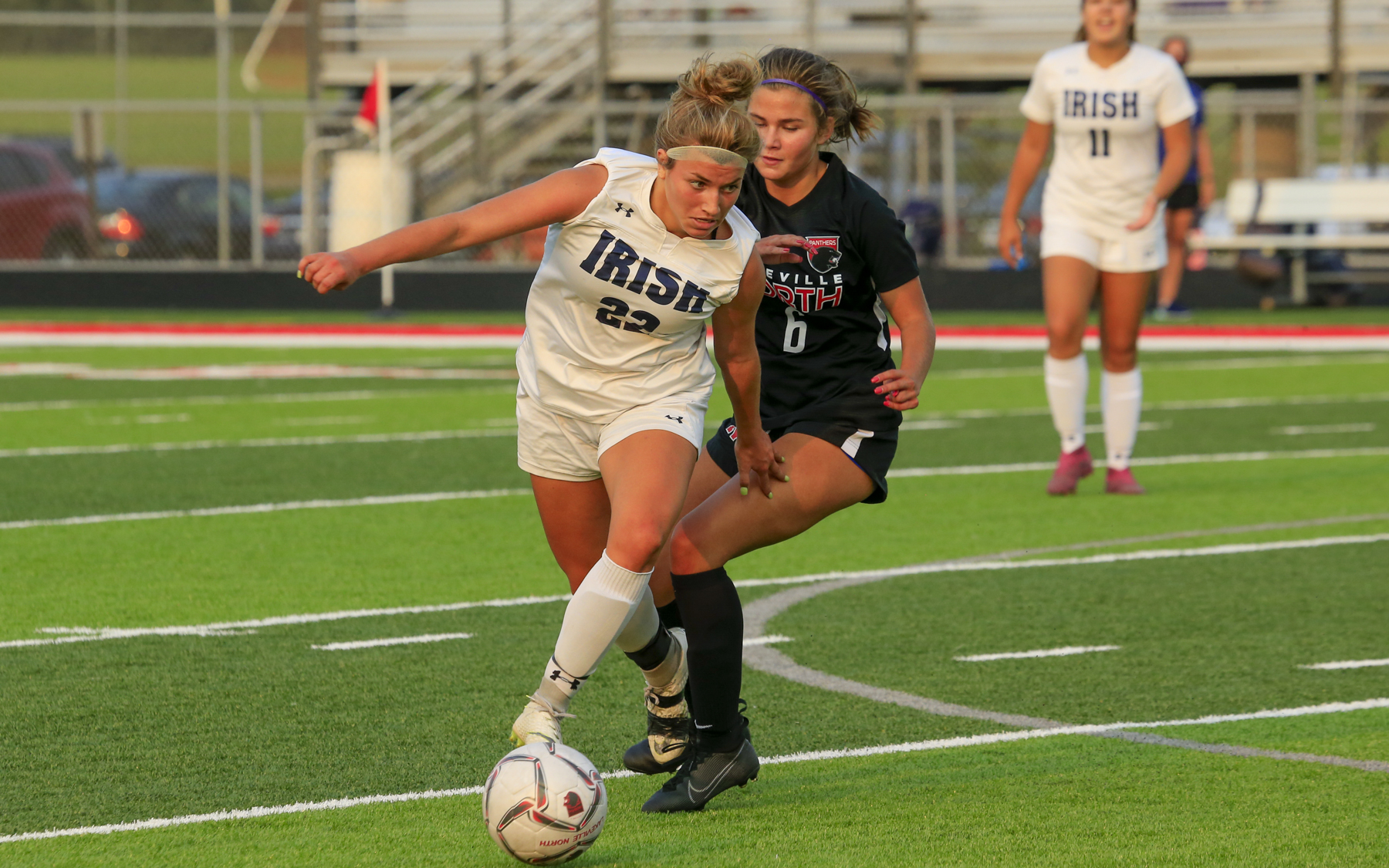 Rosemount’s Alexis Orlando (22) looks for space as Lakeville North’s Mia Okubo (6) defends. The Irish and Panthers tied 0-0 in a South Suburban Conference match at Lakeville North High School. Photo by Jeff Lawler, SportsEngine