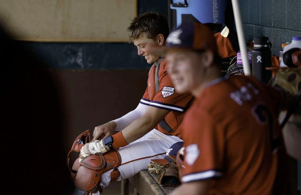 Helena Senators catcher Tizer Lindgren and pitcher Cohen Sassano share a laugh in the dugout during Thursday's 8-0 five-inning run-ruling of Butte. Gary Marshall, bmgphotos.com 