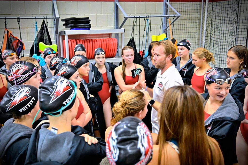 swim team with coach