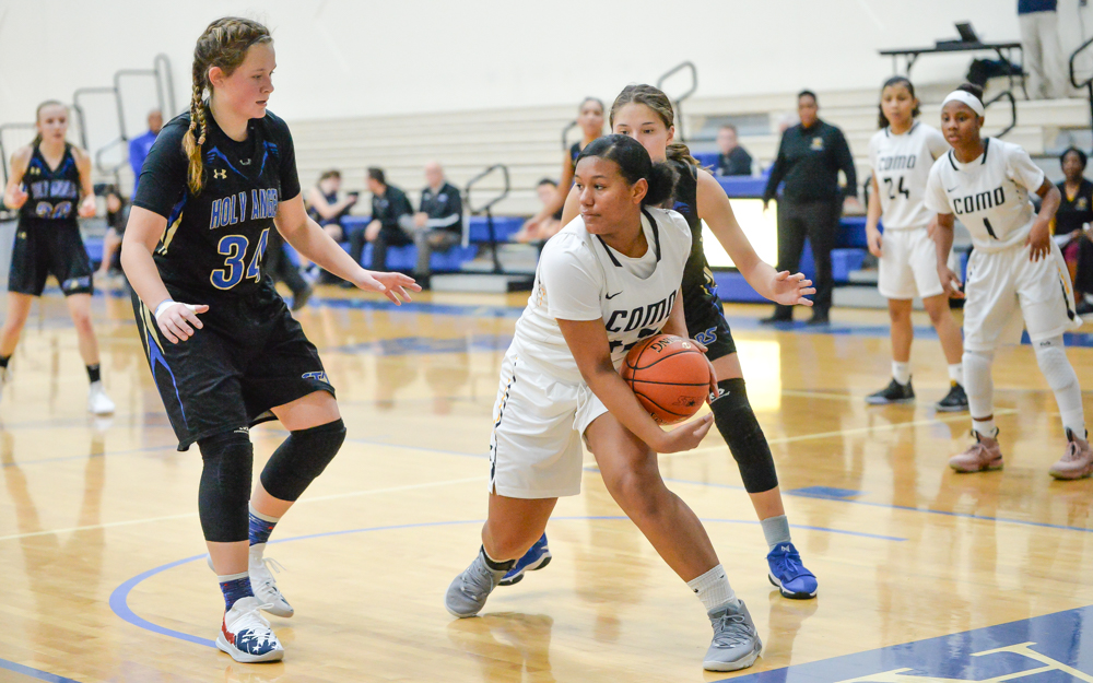 St. Paul Como Park freshman Jada James looks for an opening early in the game. The Cougars lost to the Stars Tuesday night 90-88. Photo by Earl J. Ebensteiner, SportsEngine