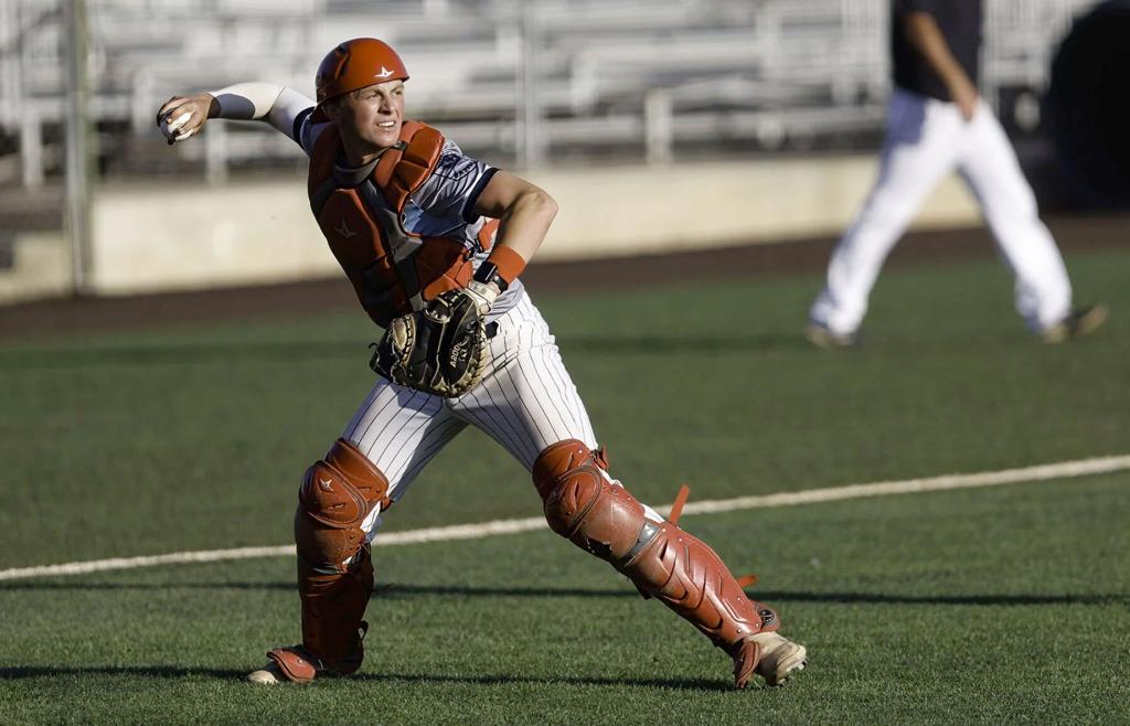   Helena Senators catcher Tizer Lindgren fields a sacrifice bunt during Thursday's 7-6 victory over the Belgrade Bandits at Kindrick Legion Field. Lindgren threw out a would-be Belgrade base-stealer in the fourth inning. Gary Marshall, BMGphotos.com 