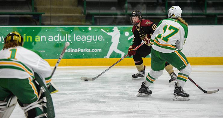 Maple Grove forward Mannon McMahon (10) looks to shoot against Edina. Photo by Carter Jones, SportsEngine