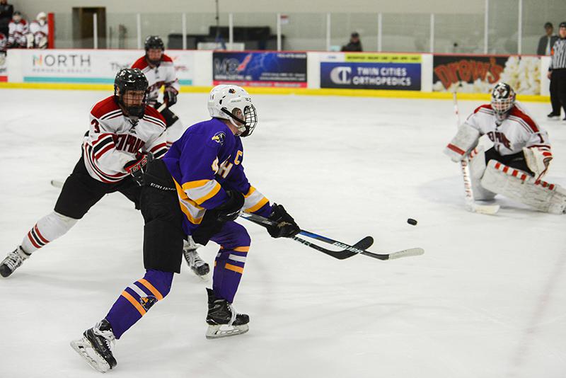 Chaska defender Mike Koster (4) slings a backhand shot towards the net against Eden Prairie. Photo by Carter Jones, SportsEngine