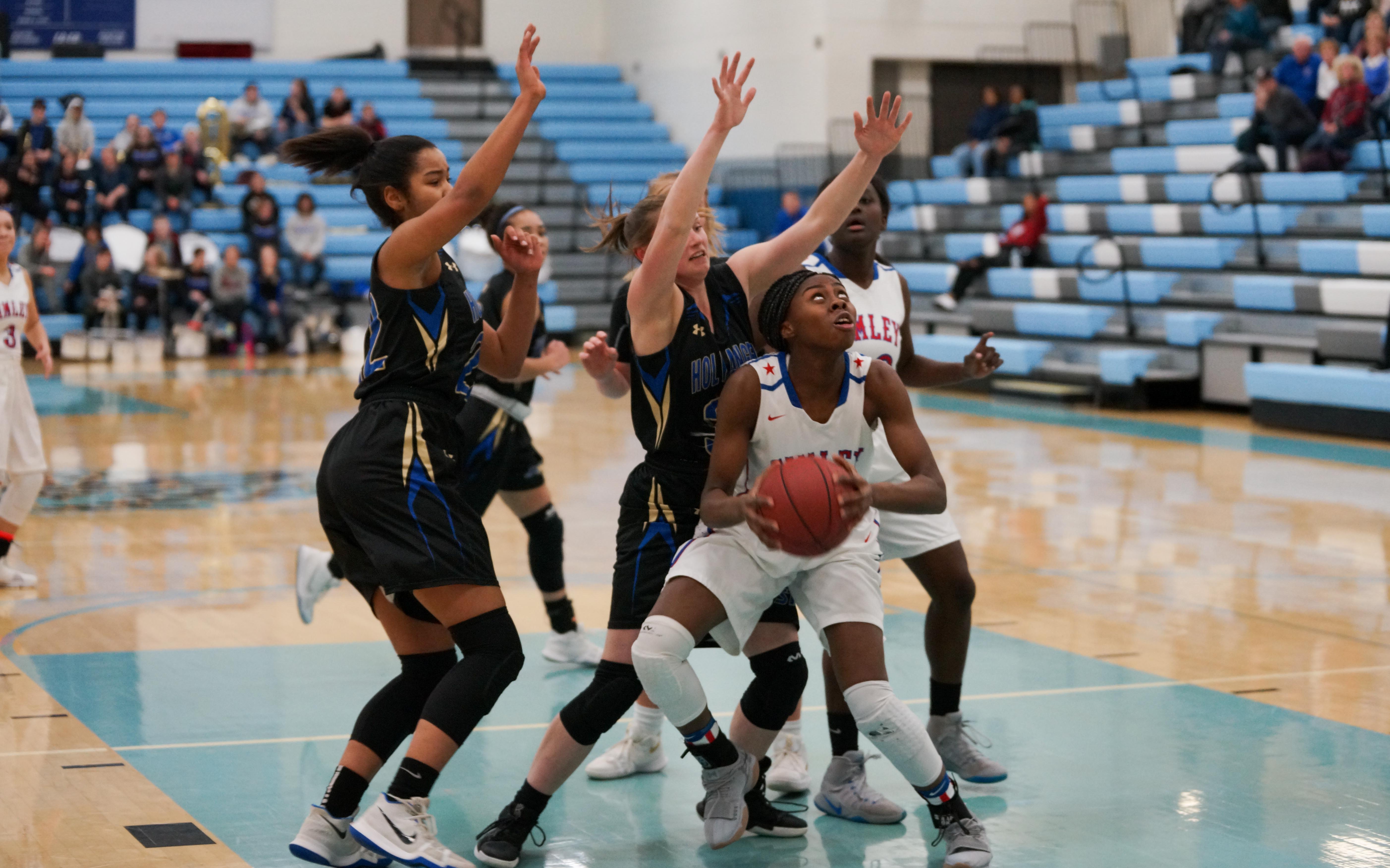 Simley's Tiwaah Danso fights for a look at the basket after grabbing a rebound against Holy Angels on March 9. Danso led her Spartans with 14 points in the section final loss. Photo by Korey McDermott, SportsEngine