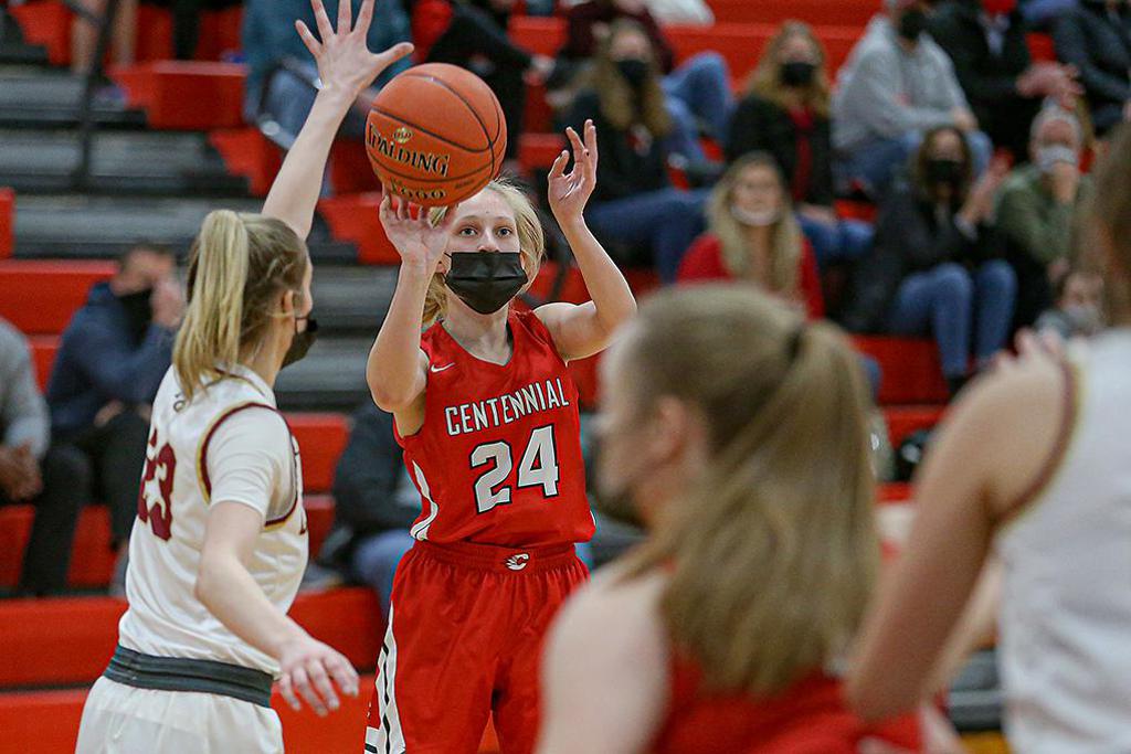 Sophomore Megan Stacy (24) puts up the first of her two three-point baskets late in regulation that gave Centennial its first lead of the game. Photo by Mark Hvidsten, SportsEngine