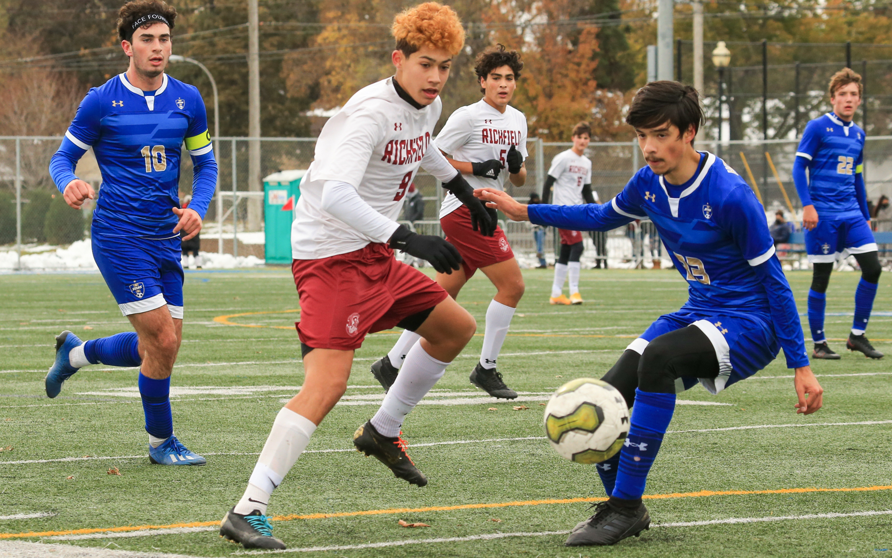 Richfield’s Rodrigo Castaneda Rodriguez (9) taps the ball back to a teammate on a give-and-go play against Holy Angels Saturday afternoon. The Spartans fell to the Stars 4-1 at the StarDome in Richfield. Photo by Jeff Lawler, SportsEngine