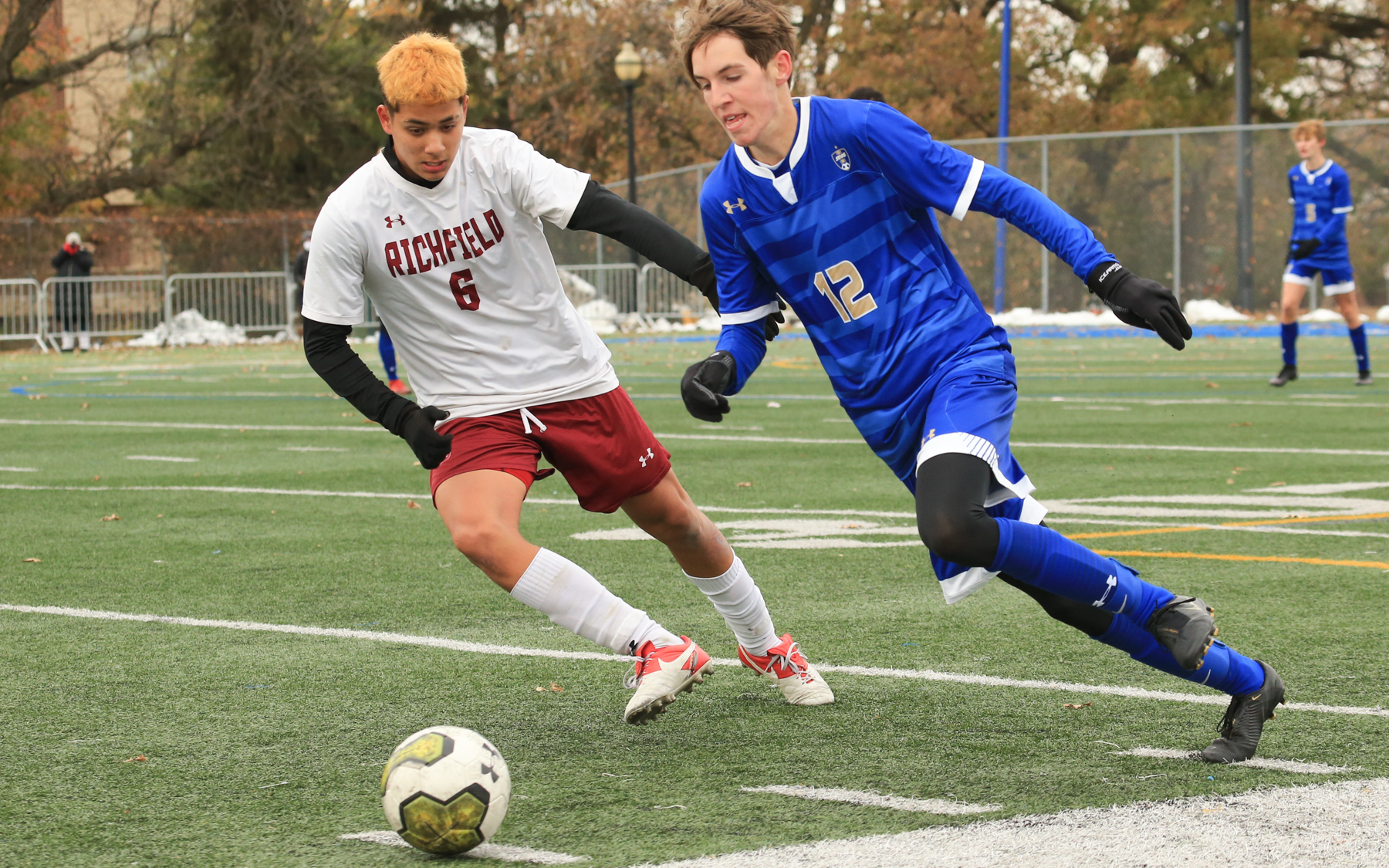 Holy Angels senior Jack Menke (12) races for a loose ball as Richfield’s Osvaldo Avila Rodriguez pursues. Menke had a goal in the Stars’ 4-1 victory over the Spartans in the Class 1A, Section 3 final. Photo by Jeff Lawler, SportsEngine