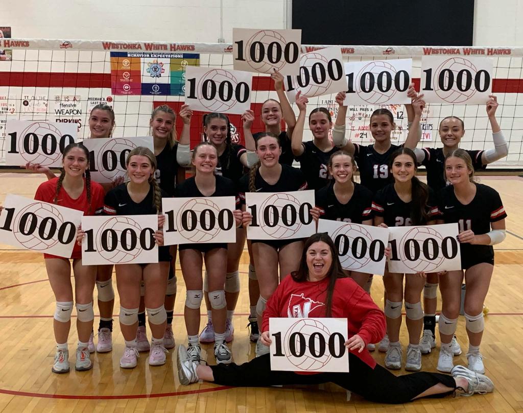 volleyball team with signs