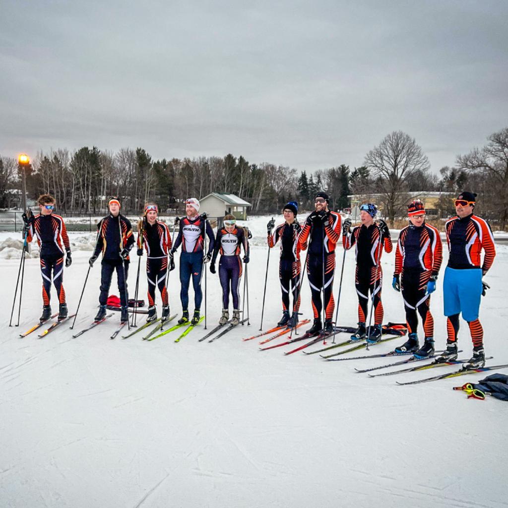 Image of TNT Nordic skiers standing in a line at Hoigaards Relay meet at Elm Creek