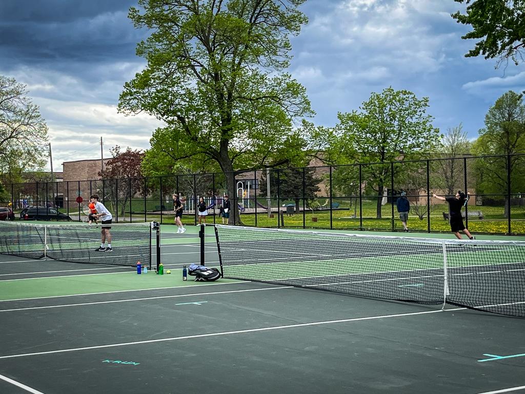 Minneapolis Roosevelt Boys Tennis doubles players during a match vs Mpls South