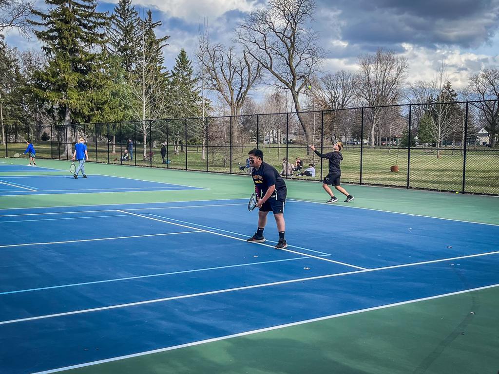 Minneapolis Roosevelt High School Teddy Boys tennis doubles players during a match at Folwell Park