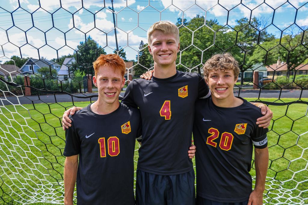 Image of Minneapolis Roosevelt High School’s boys varsity soccer team Captains of 2025 grouped together for a photo on the field at Al Gowans Stadium