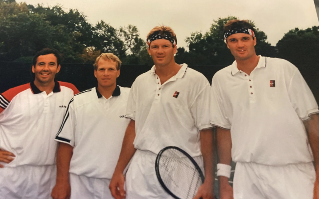 Photo of Greg Wicklund with tennis pros Davide Wheaton and others