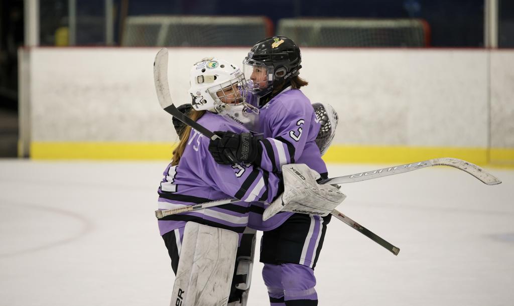 Piper Blaskowitz hugs Analeigh Klingelhoets as Team MN shuts out Wisconsin