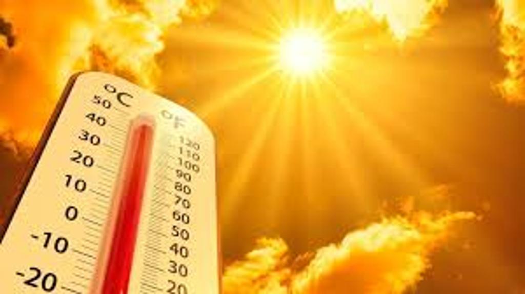 Thermometer against orange sky with shining sun