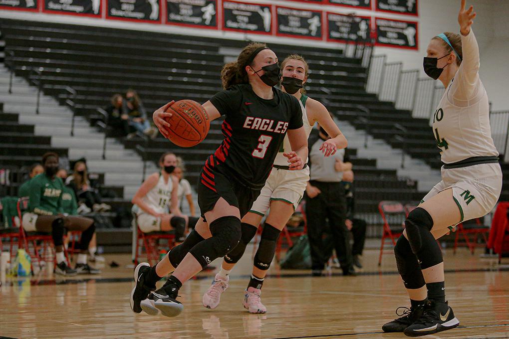 Eden Prairie's Molly Lenz (3) drives as Rochester Mayo's Mia Harber defends. Lenz scored a team-high 16 points for the Eagles. Photo by Mark Hvidsten, SportsEngine