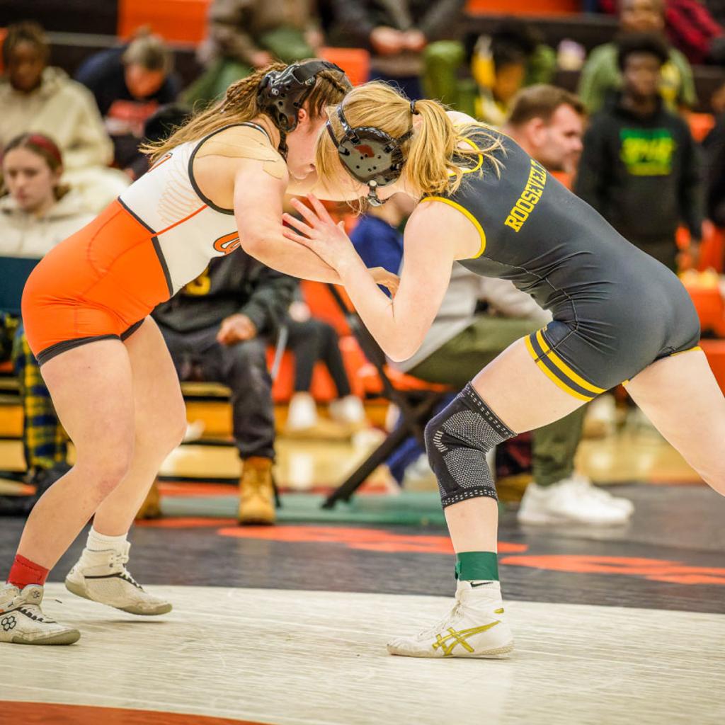 Minneapolis Roosevelt Wrestler Sam Hinman locks arms with her Osseo opponent during the Tournament Final of the Osseo Grit & Grace Girls Invitational Wrestling Meet
