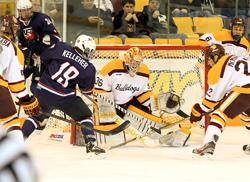 Tyler Kelleher looks for a rebound in front of the Bulldog net. Photo by 