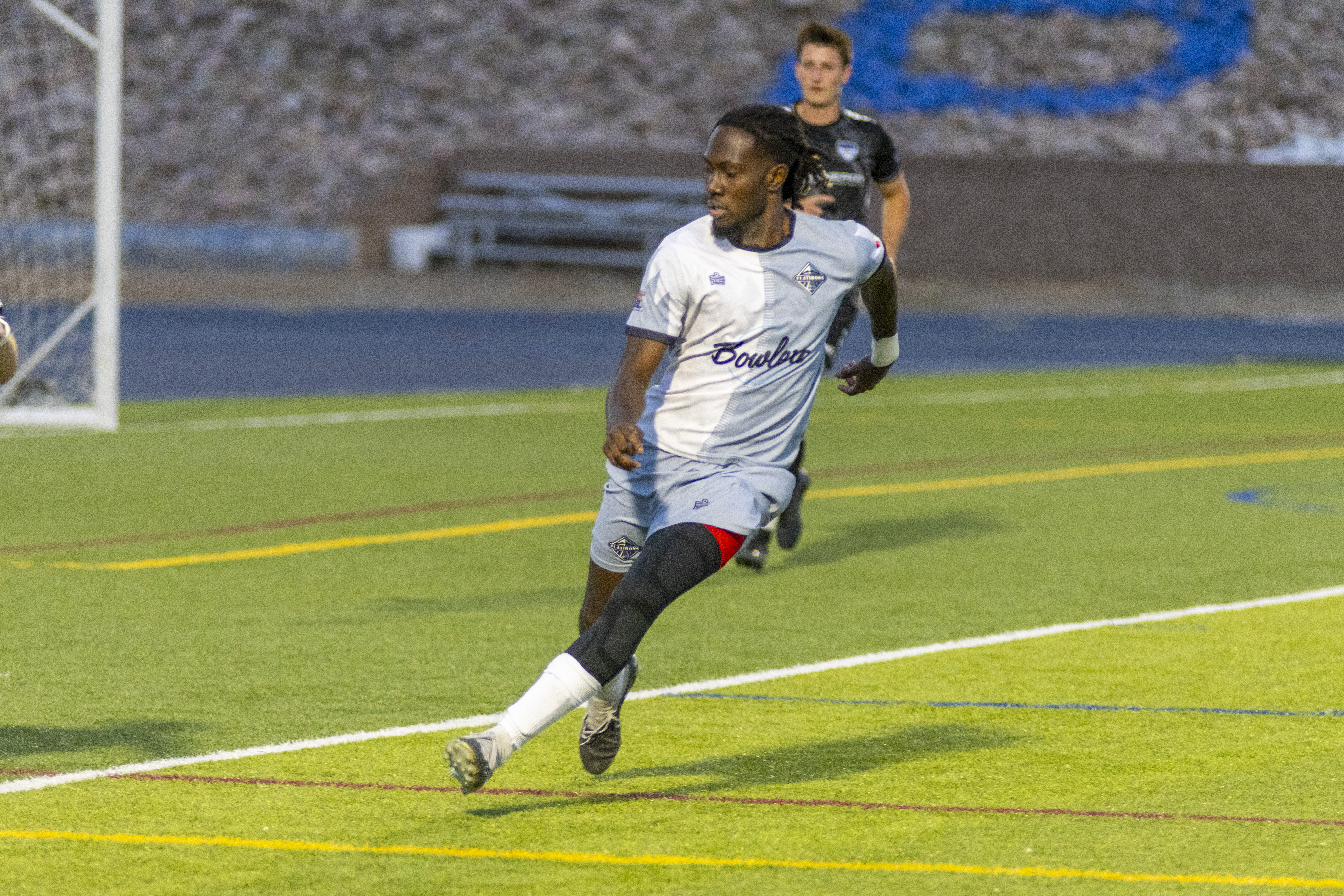 Flatirons FC player Sami Owusu runs in a match.