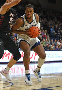 Eric Dixon holds a basketball