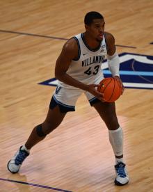 Eric Dixon holds a basketball