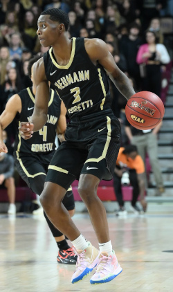 Aamir Hurst dribbles a basketball