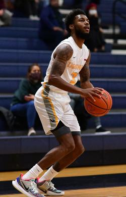 Nazim Derry shoots a basketball