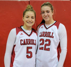 Brooke and Taylor Wilson stand in a gym