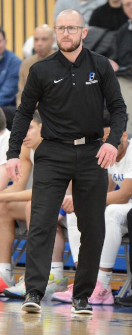 Ron Morris stands on the sidelines during a game