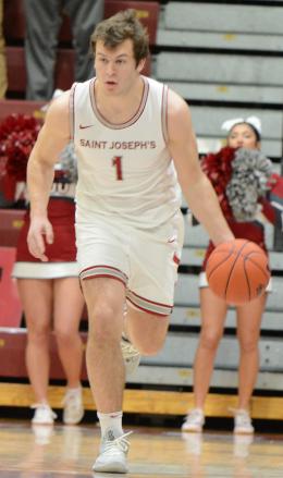 Ryan Daly dribbles the basketball